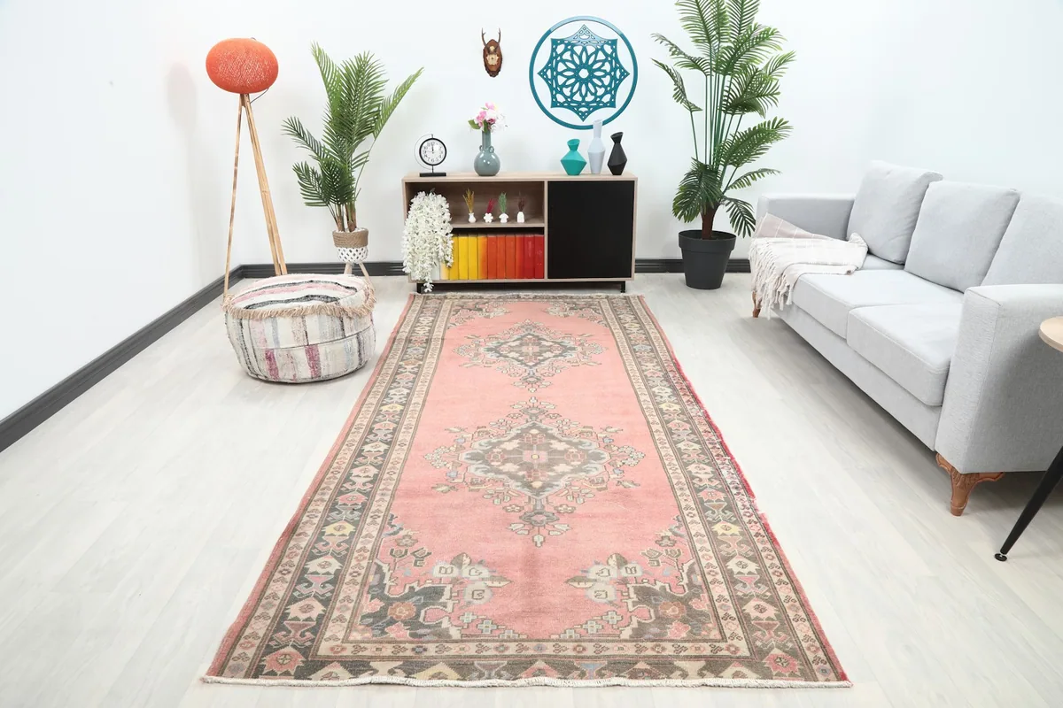 Vintage Anatolian runner rug in a modern living room setting with a gray sofa