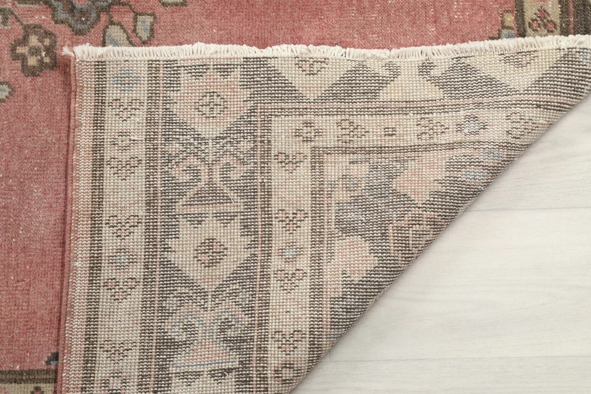 Reverse side of the rug, revealing the tight weave of the cotton foundation