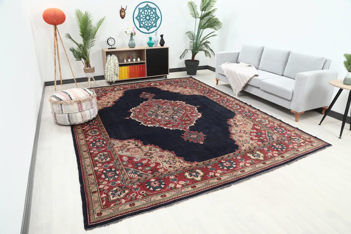An overhead angle of the Navy Medallion Anatolian Rug in a room setting, highlighting its scale.