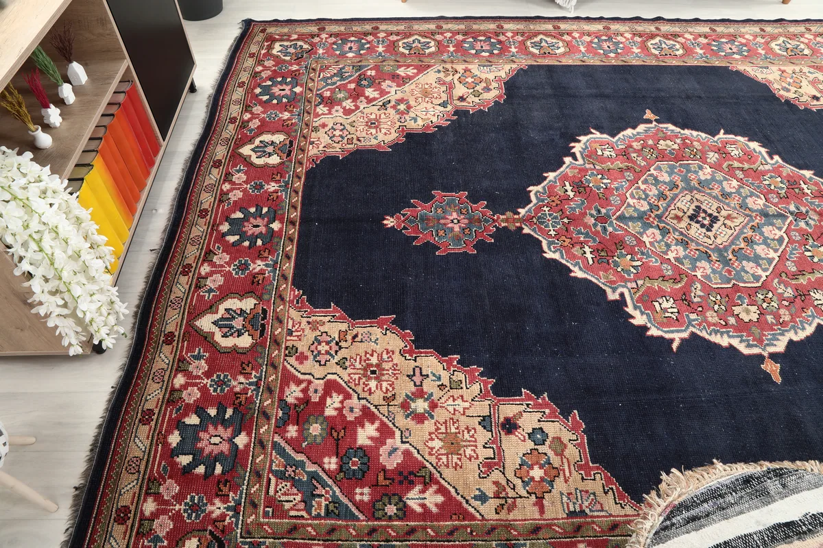 Side angle of the Navy Medallion Anatolian Rug, showing the width and the detailed side border.