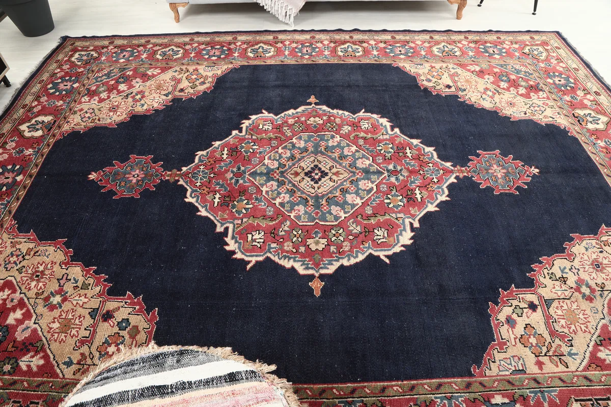 Full view of the Navy Medallion Anatolian Rug from an elevated angle, capturing its overall grandeur.