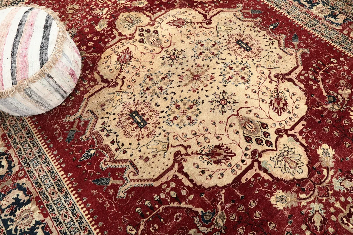 Close-up of the central beige medallion with intricate floral designs