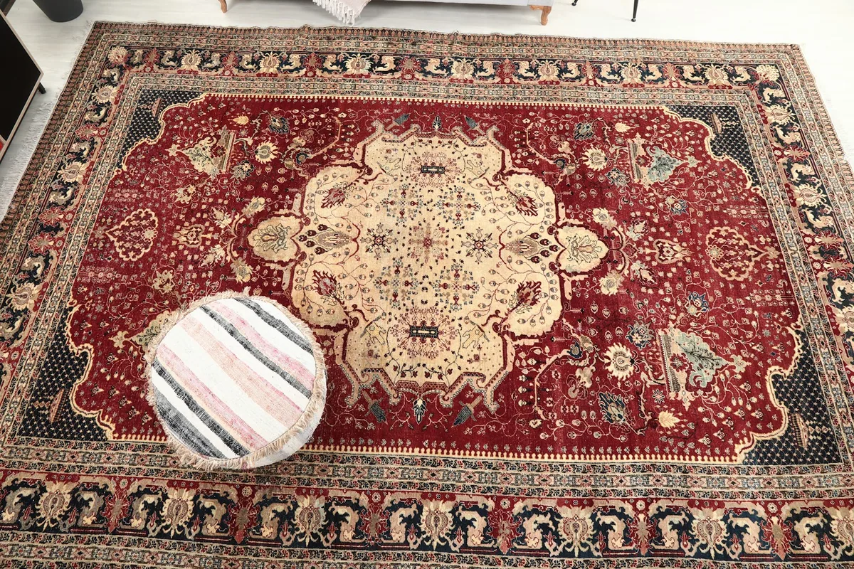 Overhead view of the rug in a room, showing the full design and scale