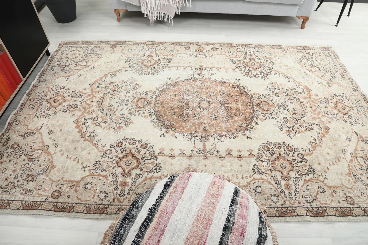 Cream Rust Medallion Anatolian Rug in a room, emphasizing its complementary colors and soft aesthetic.
