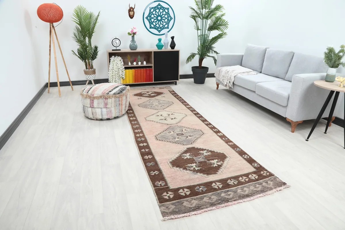 Full view of the runner rug in a contemporary living space, showing its length and colors
