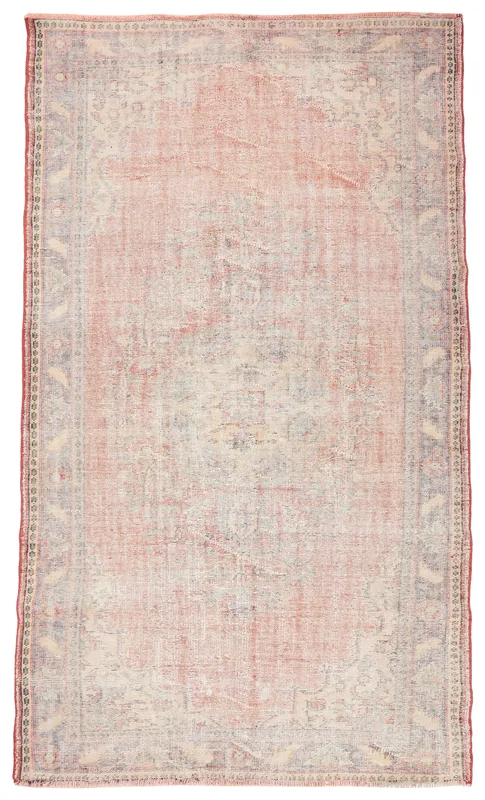 Full top view of a 5'9" x 9'9" vintage Anatolian area rug with a faded rose field and gray border