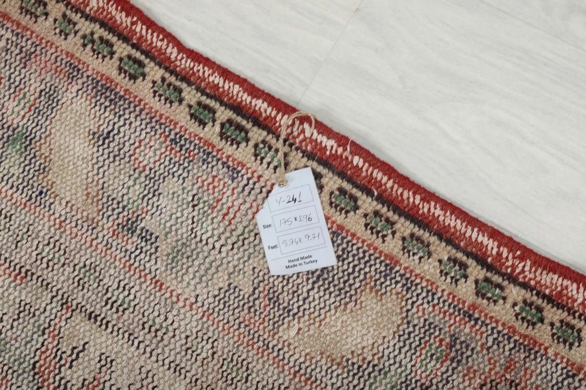 Close-up of the rug's back and a label with product information and origin