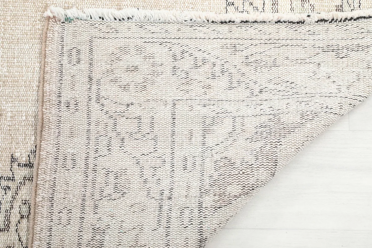 Close-up of the back of the hand-knotted wool pile on cotton foundation