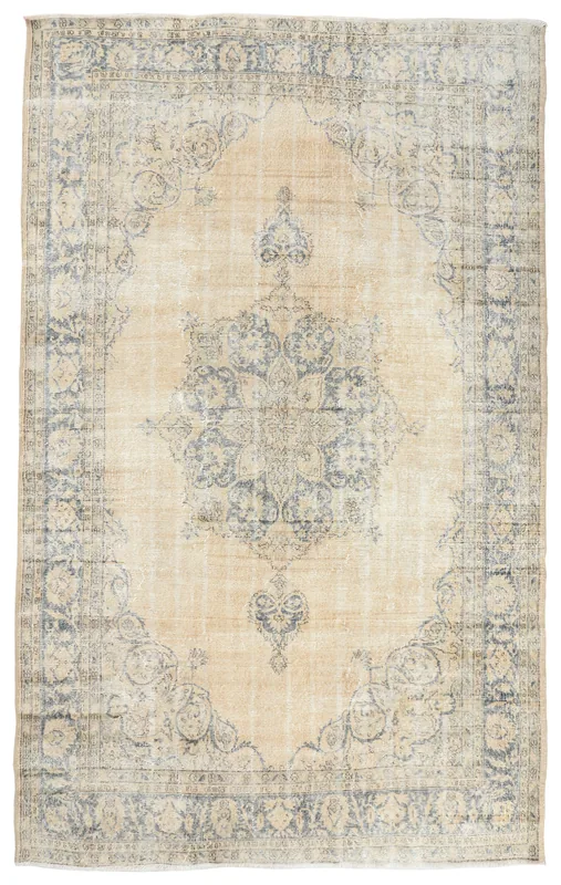 Full overhead view of the beige and blue medallion vintage Anatolian rug