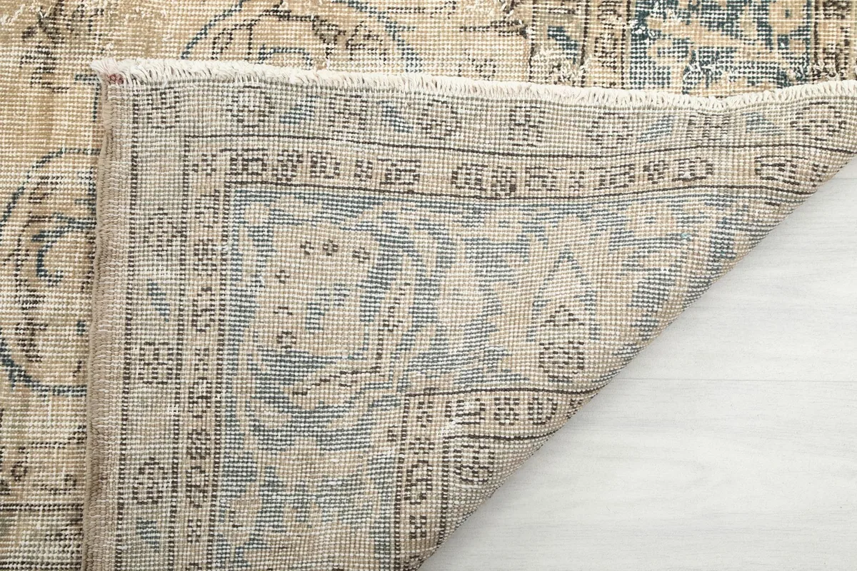 Close-up of the cotton foundation and reverse side of the vintage rug