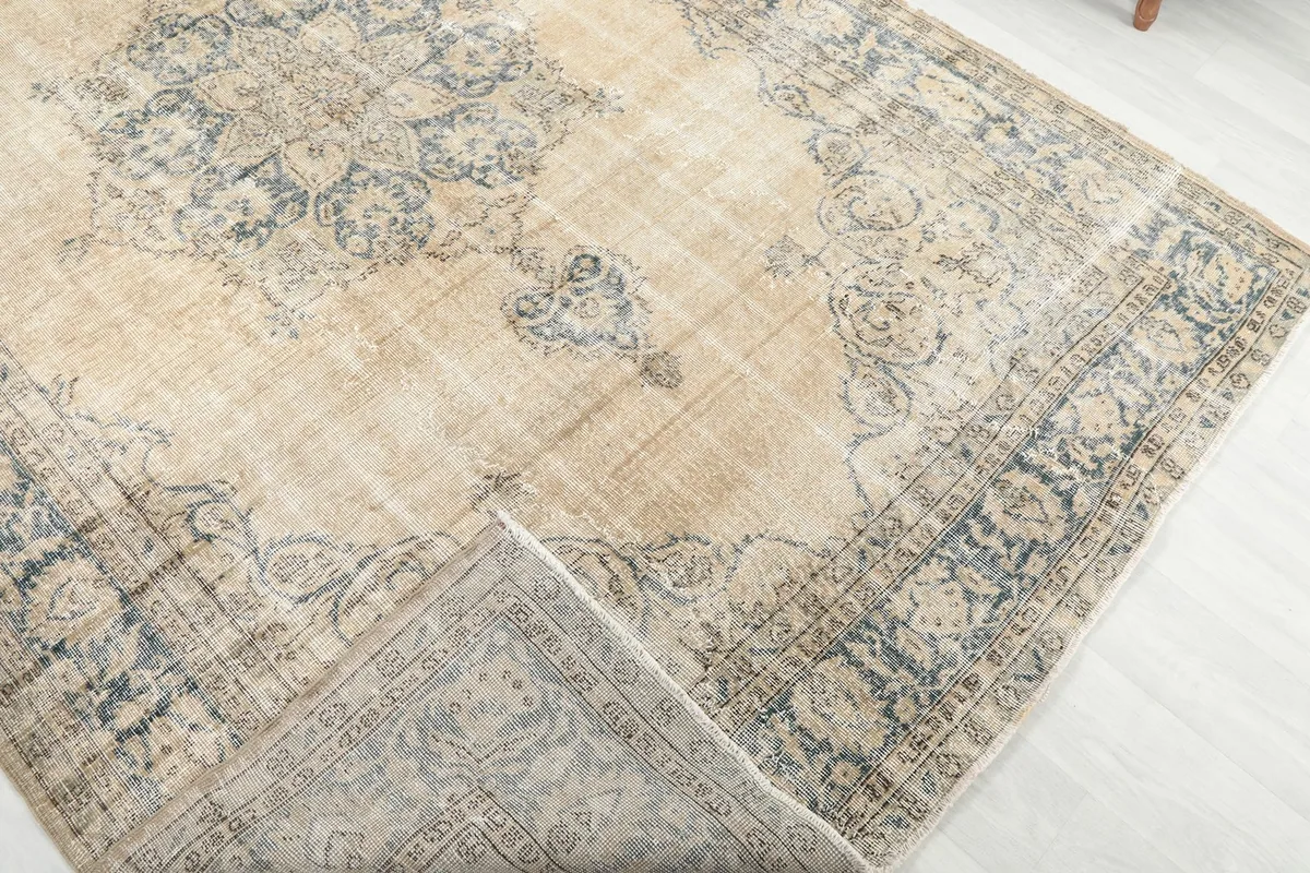 Folded corner revealing the reverse side of the hand-knotted rug