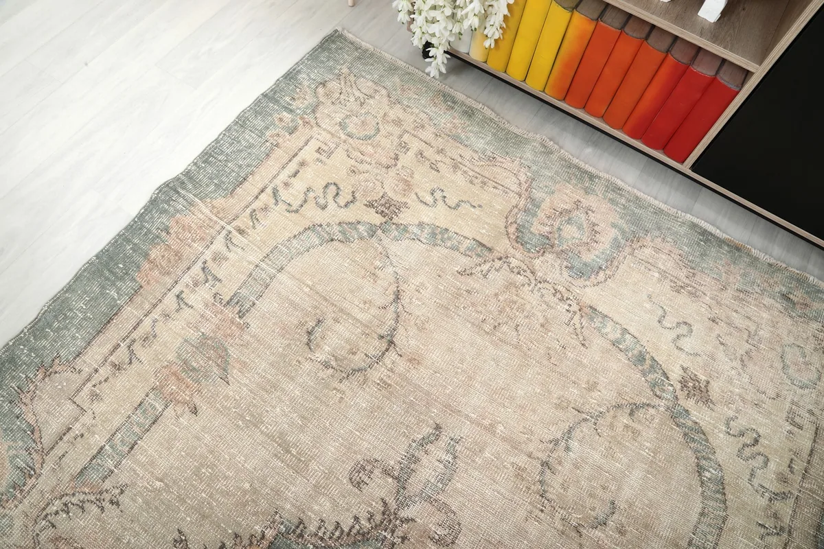 Top-down angle showing the upper left corner of the vintage rug
