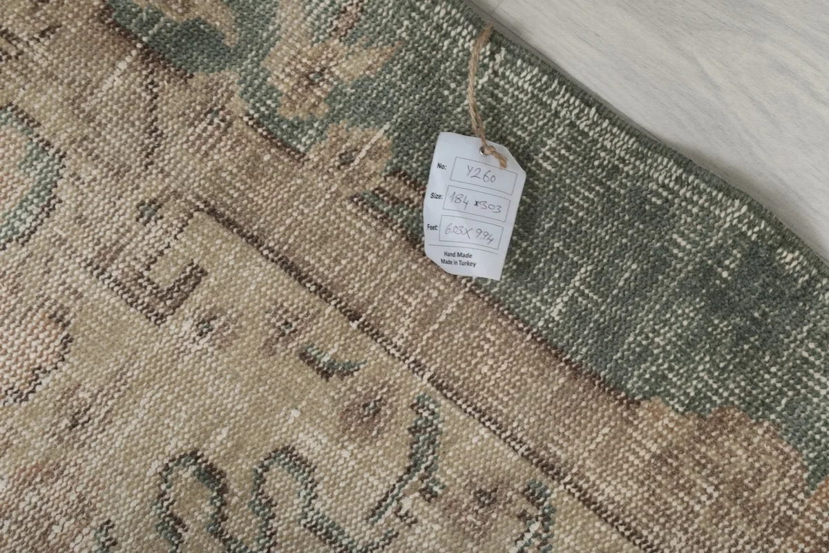 Close-up of the rug's label attached to the edge, showing product information