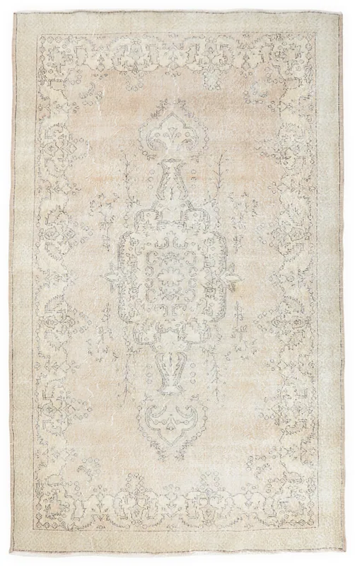 Full top view of the beige and ivory medallion vintage Anatolian rug