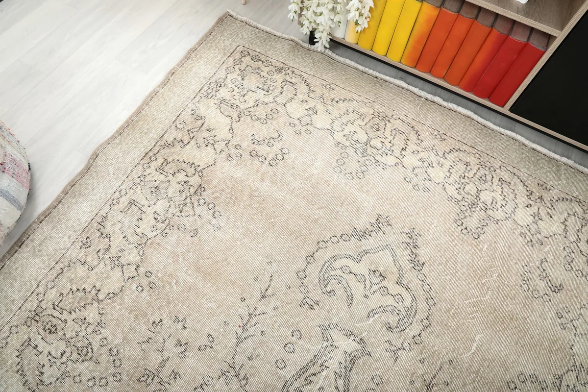 Top-down angle of the rug's corner, showing the border and field design