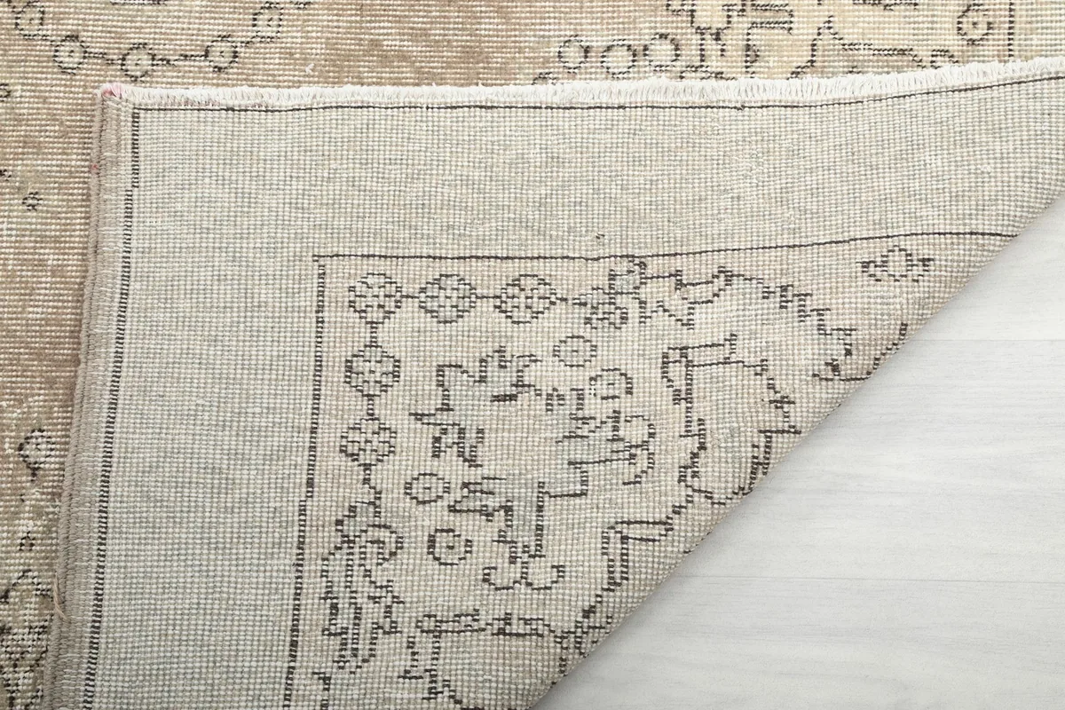 Close-up of the rug's reverse side, showing the weave and back of the pattern