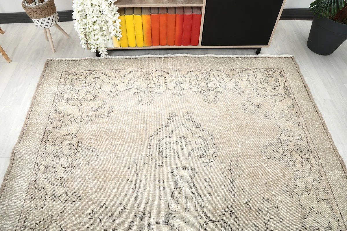 Overhead view of the rug, emphasizing the central medallion and surrounding patterns