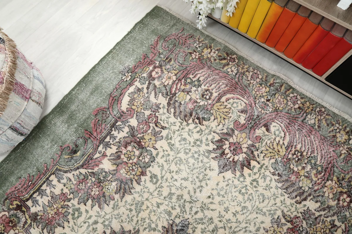 Top-down angle highlighting the corner of the rug with its detailed border and field