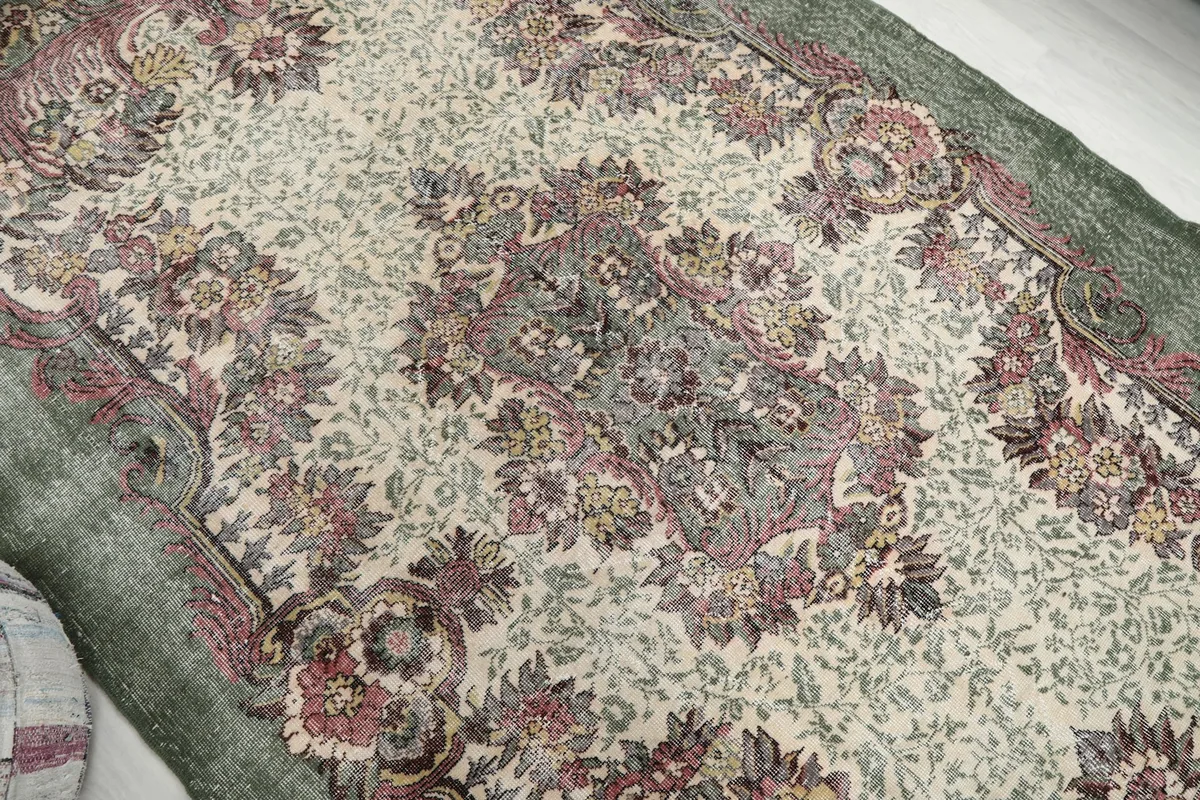 Overhead view focusing on the central medallion and surrounding floral motifs