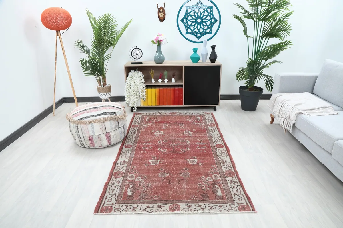 Rust floral Anatolian rug displayed in a modern living room setting