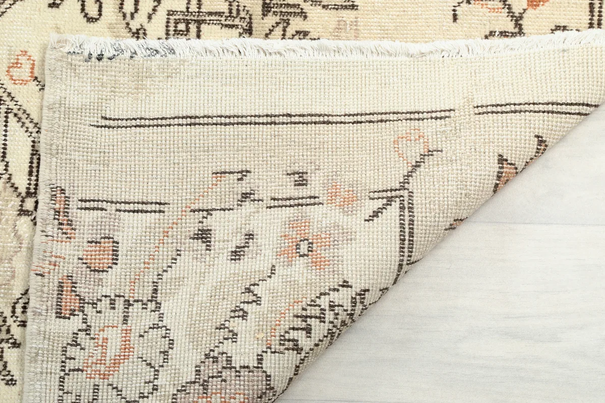 Close-up of the Cream Rose Floral Anatolian Runner's fringe and the reverse side, highlighting craftsmanship.