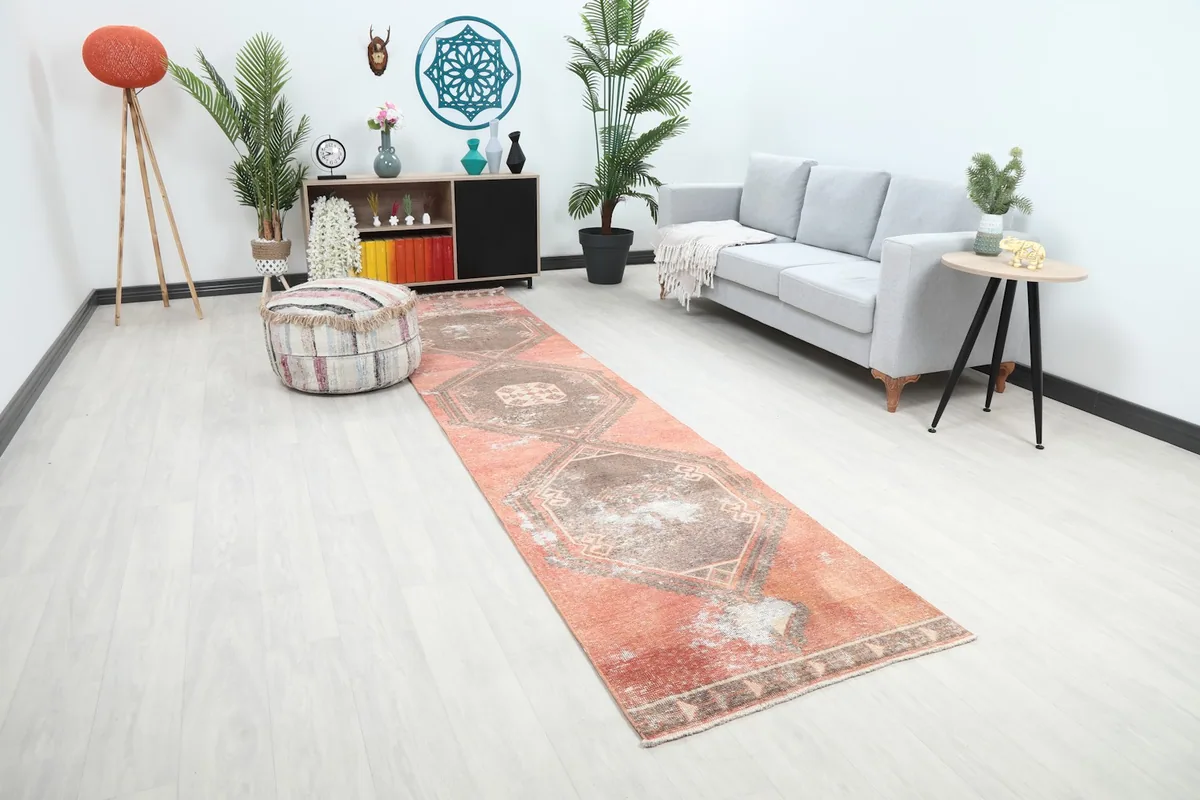 Angle view of the Anatolian runner rug extending through a hallway or living area