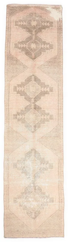 Full top view of the 3'3" x 13'3" vintage rose and gray geometric runner on a white background.