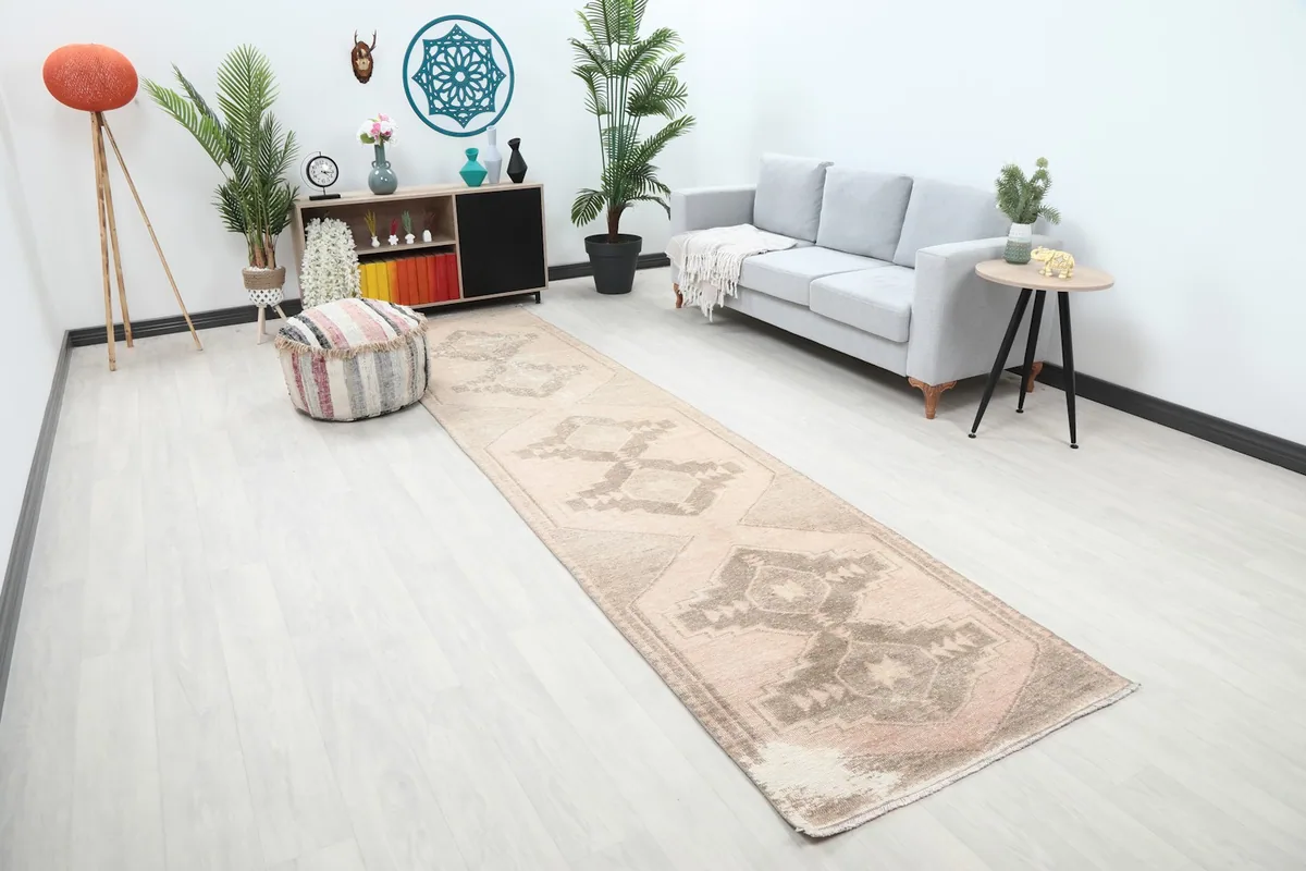 Overview of the runner rug in a room, highlighting its placement along a wall with furniture.