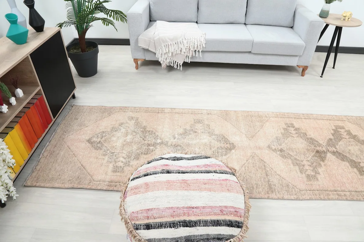 Full view of the rug in a room from a higher angle, emphasizing its role in defining the space.
