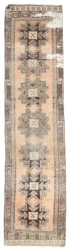 Full top view of the vintage Anatolian runner rug with tan field and geometric motifs