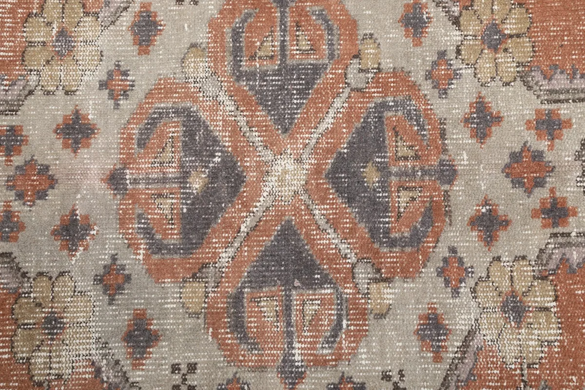 Close-up detail of the central medallion's intricate geometric and floral patterns.