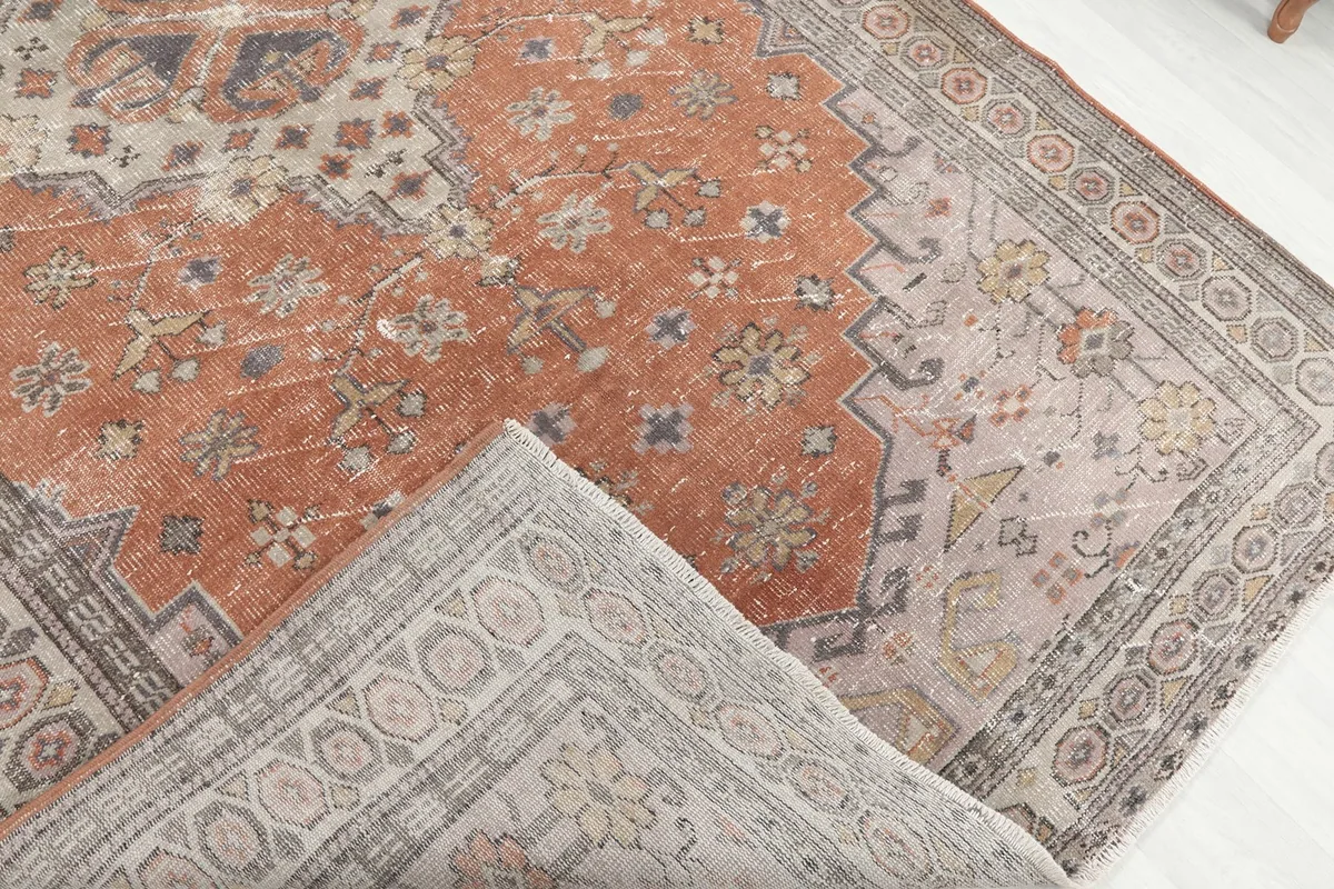 Underside of the hand-knotted wool rug, revealing the cotton foundation and knotting.