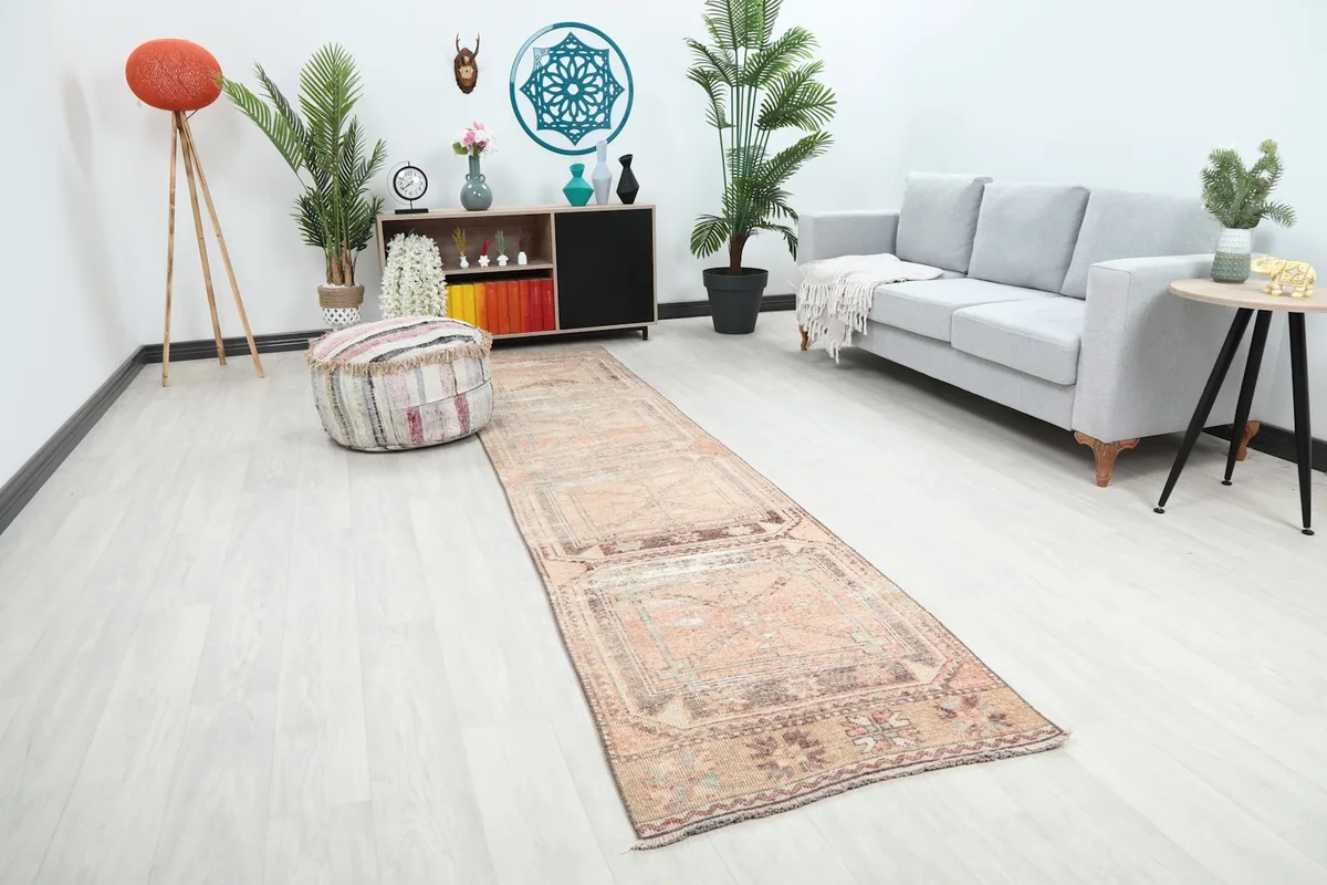 Angle view of the runner rug in a room, highlighting its geometric patterns and vintage character.