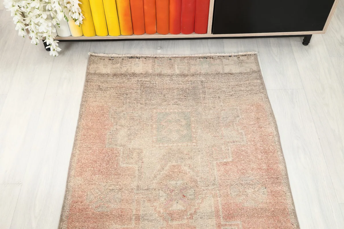 Overhead view of a section of the runner, emphasizing its faded colors and traditional Anatolian design.