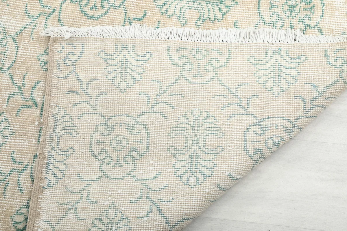 Close-up of the back of the rug, demonstrating the hand-knotted construction