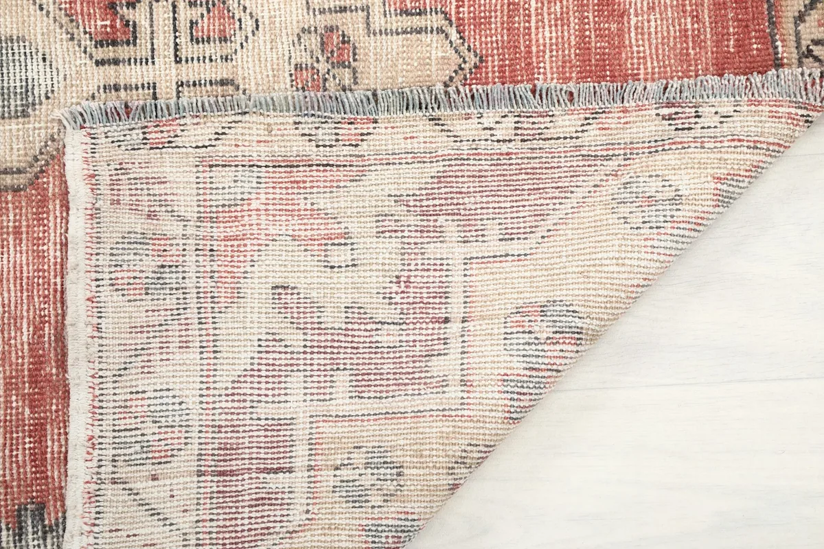 Another view of the rug's backside, showing the tight knotting and construction