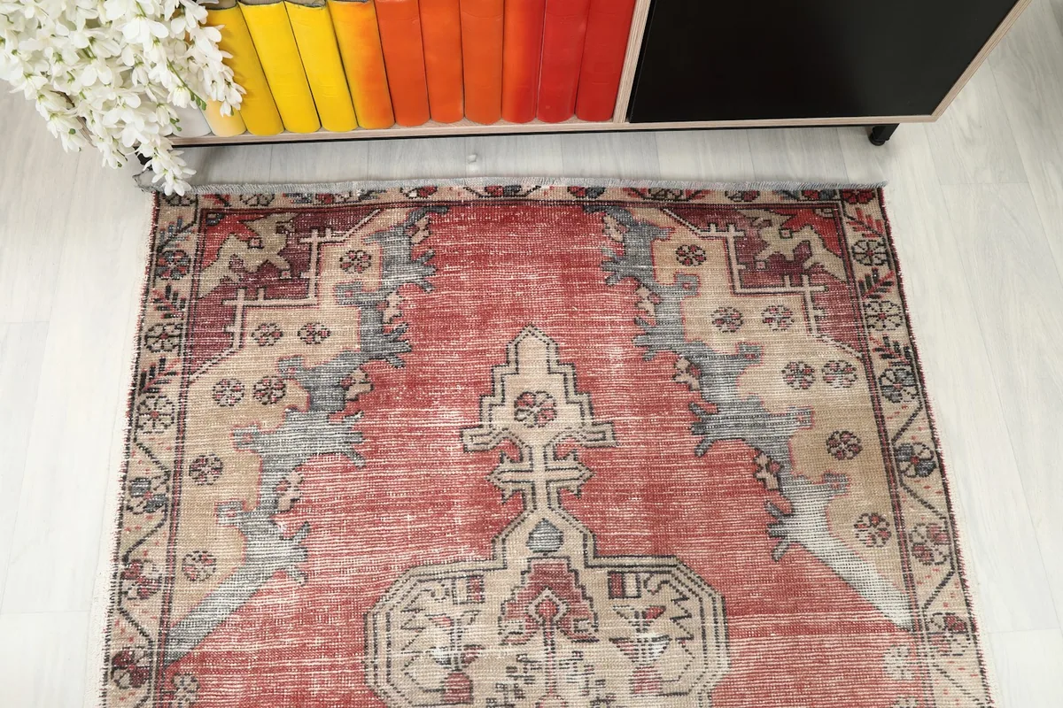 Overhead view focusing on one end of the rug, showing the geometric field design