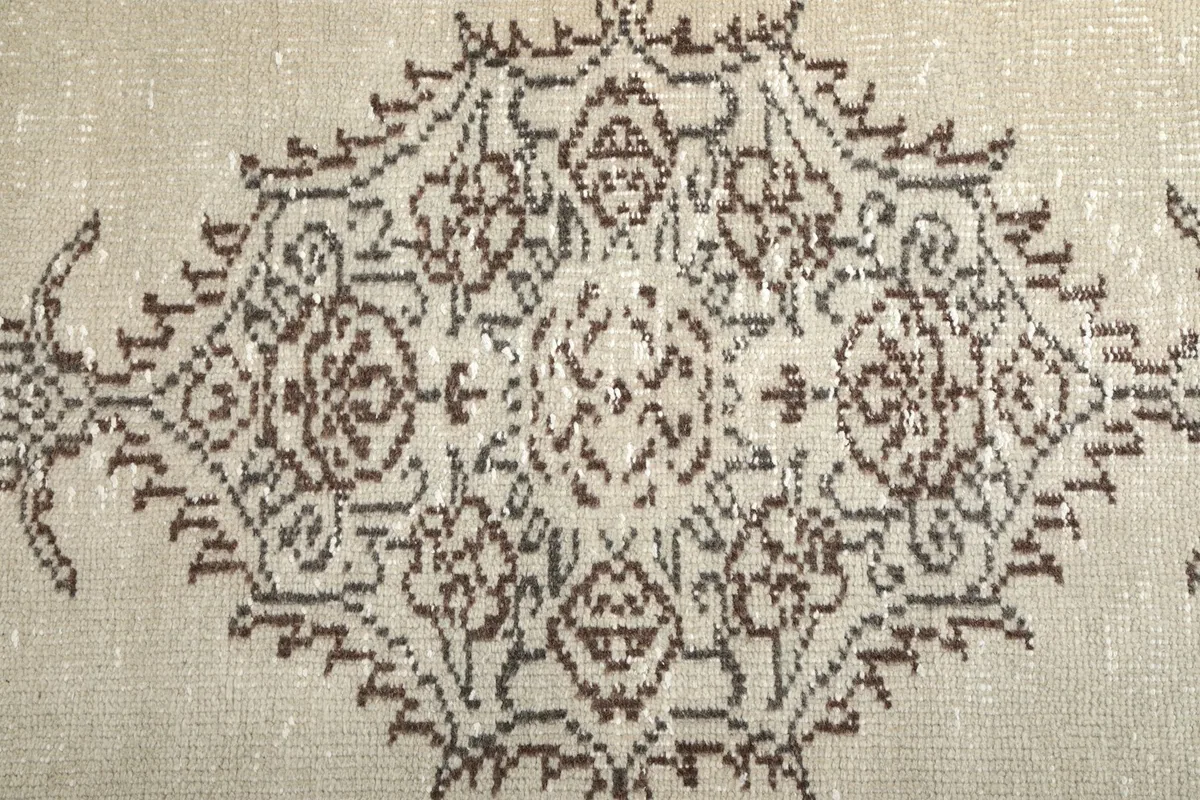 Close-up of the intricate brown medallion pattern and surrounding details