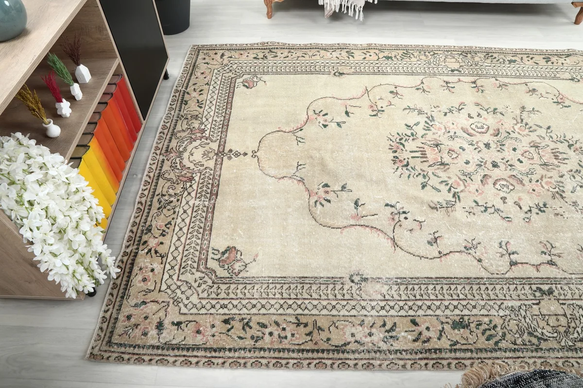 Side angle of the rug, showcasing its full length and the patterns near a bookshelf