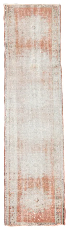 Full overhead view of the vintage rust and cream Anatolian runner rug on a white background