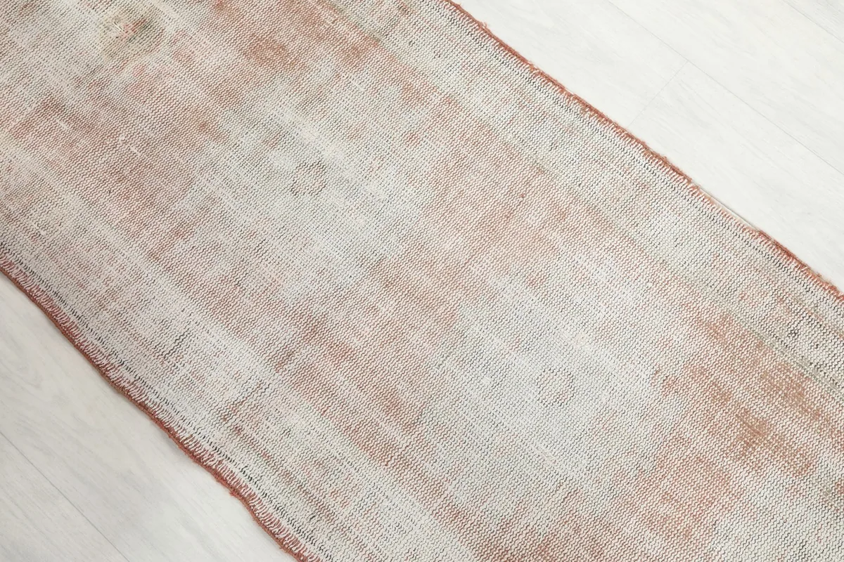 Overhead angled shot showing the distressed texture and color variation of the runner