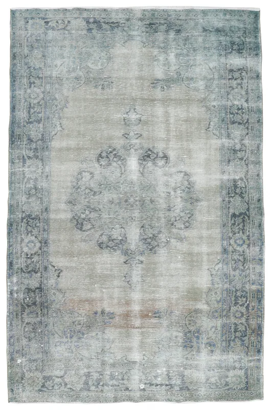 Full overhead view of the gray and blue vintage Anatolian rug