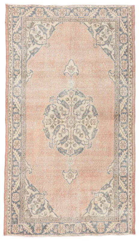Full top view of the rose and blue medallion vintage Anatolian rug on a white background.