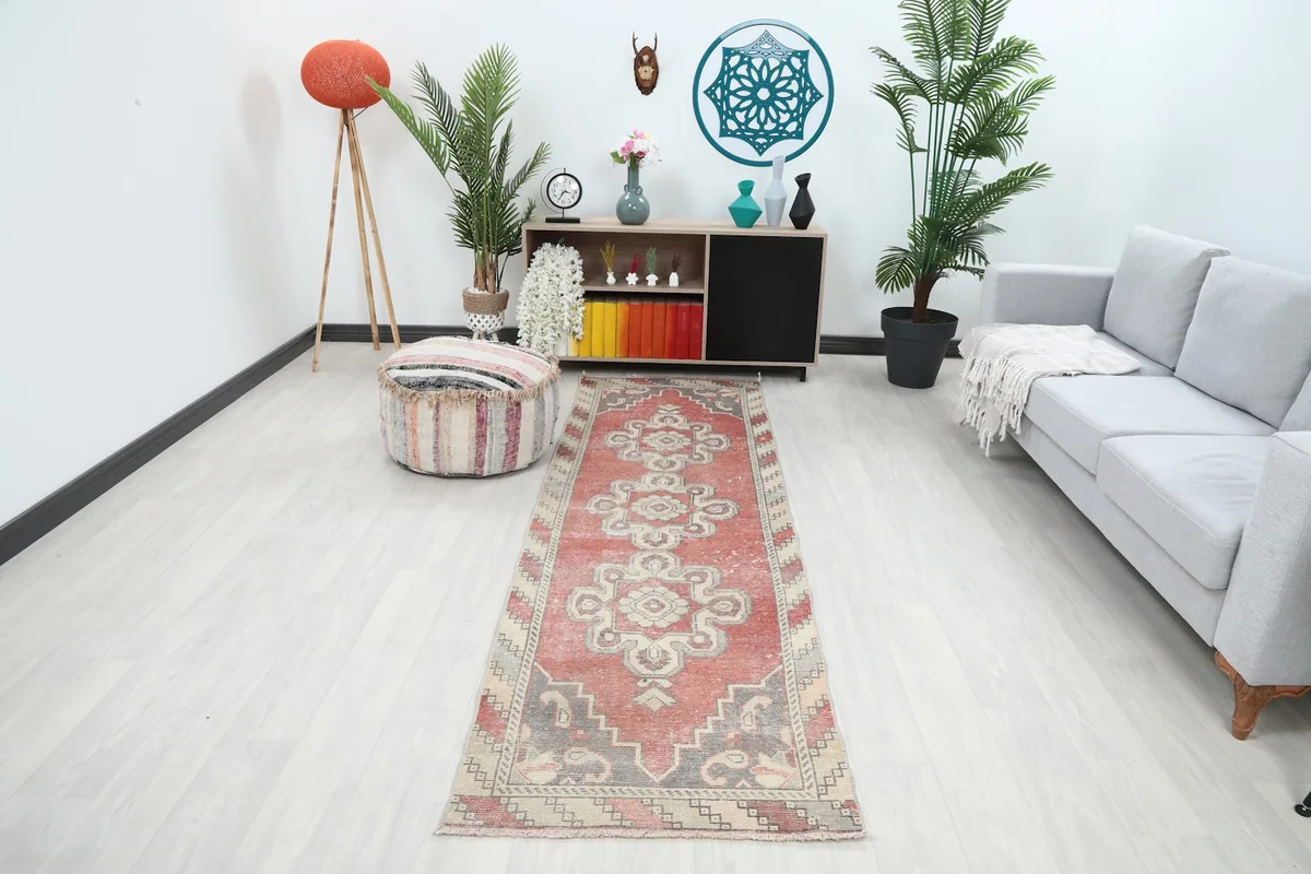 Rust vintage runner rug displayed in a modern living space with light flooring