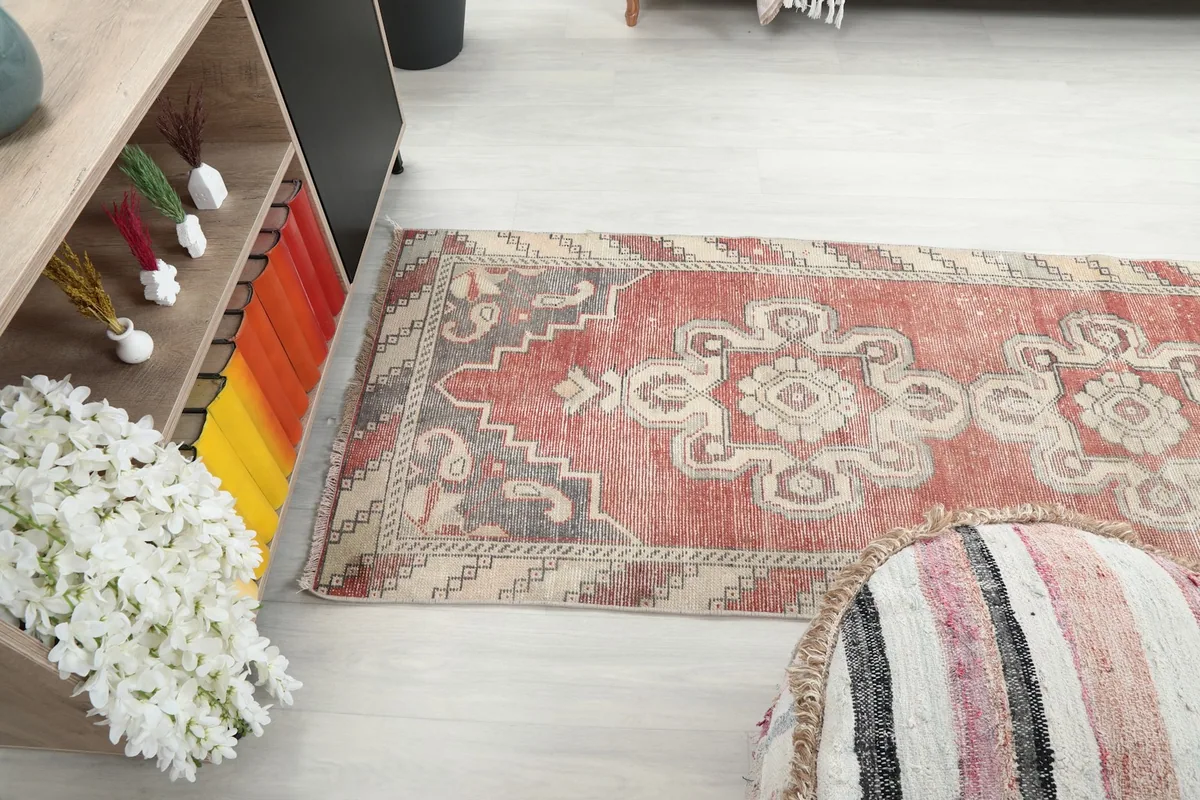 Runner rug extending into a room, showing its length and design from above