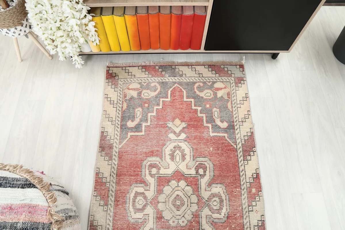 Overhead view of the rug's end section, showcasing the pattern and color variations