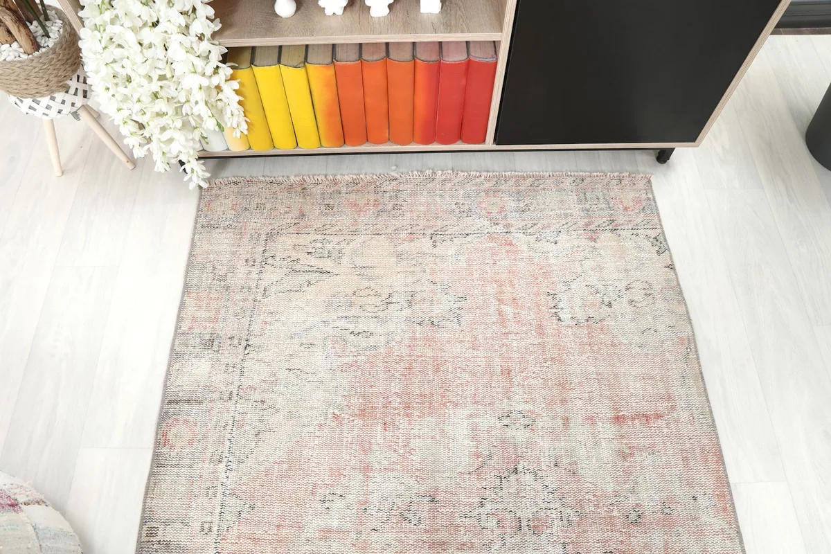Top-down view of the rug's upper section, displaying its overall pattern and color variations.