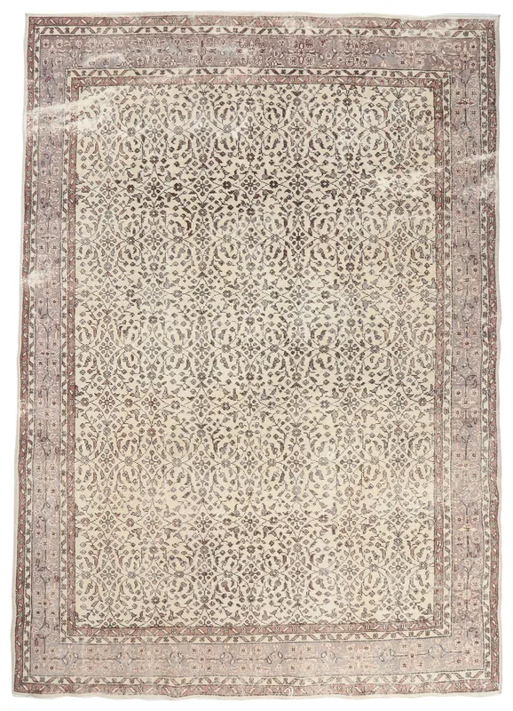 Full top view of the 7'3" x 10'1" ivory and brown floral vintage Anatolian rug on a white background.