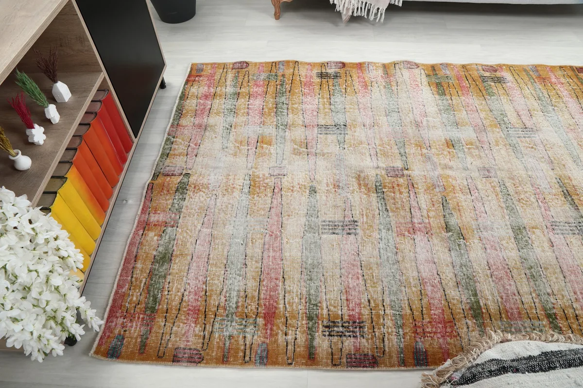 Wide angle view of the rug from above, capturing its placement in the room environment
