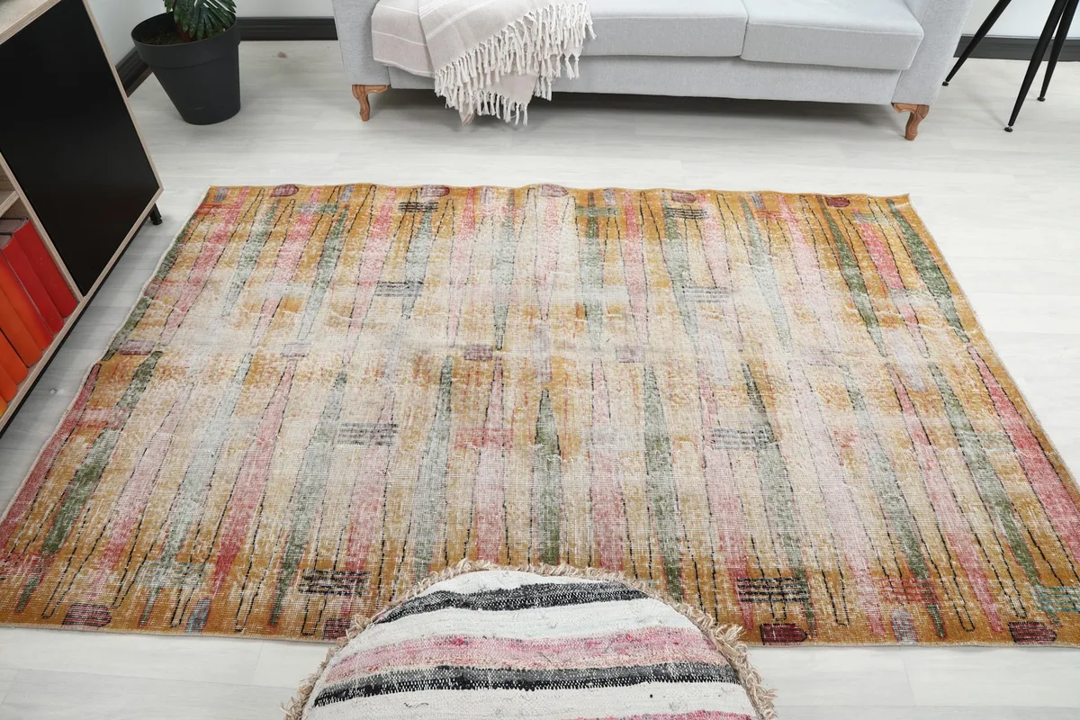 Full room view of the vintage area rug, centered in a living space with furniture